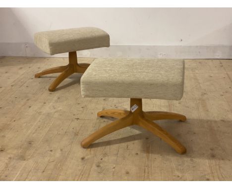 Ercol, a pair of foot stools, upholstered in oatmeal chenille fabric, raised on a blonde elm four point base with Ercol badge