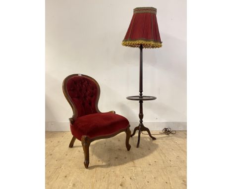 A Victorian style stained beech spoon back slipper chair upholstered in buttoned red velvet, raised on cabriole supports (H85