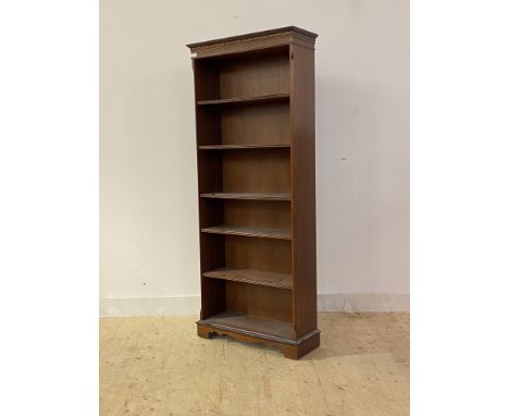 A mid 20th century mahogany floor standing open bookcase with dentil cornice, four adjustable and one fixed shelf, H184cm, W6