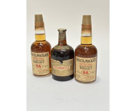 Two bottles of Whyte &amp; Mackays Special Selected Scotch Whisky circa 1966 and 1967, seals are intact, and a bottle of vint