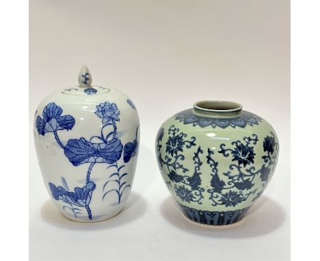 A modern Chinese blue and white ovoid ginger jar with water lily design complete with cover and finial, (28cm x 17cm) and a C