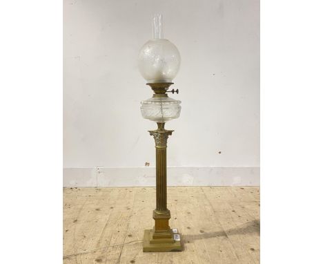 An Edwardian brass oil lamp in the form of a Corinthian column with etched glass shade, converted for electricity, H90cm