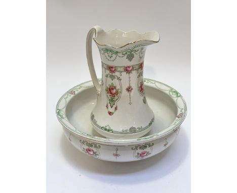 An Edwardian two piece F &amp; Son Ltd china wash set in French pattern, comprising jug with scalloped top, repaired, with sc