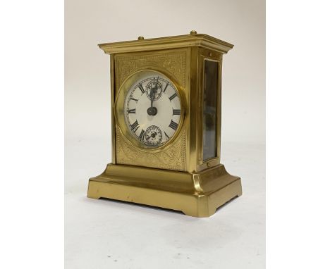 A German brass and glass carriage clock with musical alarm, circa 1890, probably Junghans, circular card dial with Roman chap