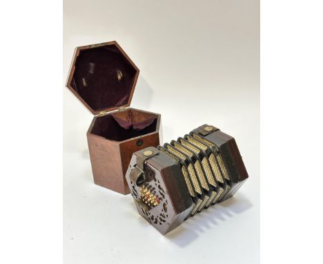 An Edwardian Lachenal &amp; Co Manufacturers London patented concertina, the mahogany case, with leather bellows, and two lea