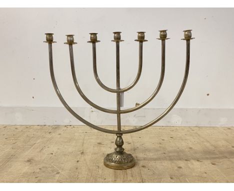 A seven branch chromium plated menorah candelabra on a circular leaf cast base, H60cm