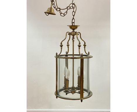 A lacquered brass hall lantern of cylindrical form, with chain and ceiling rose, H70cm (Excluding chain)