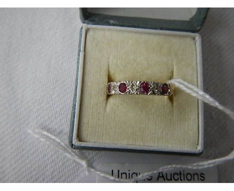 An 18ct gold diamond and ruby set ring, size K. ****Condition report**** Size rubies 3mm, diamonds 1.5mm, looks to be in good