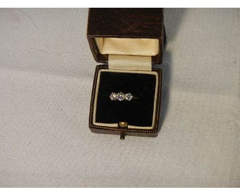 An 18ct yellow gold 3 stone 40 point diamond ring, weight 2.4 grams, size K. ****Condition report**** Centre stone 4mm, stone