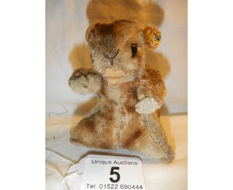 A small Steiff beaver with button in ear and glass eyes. Some wear to mohair in places but otherwise in fair condition.  9.5 