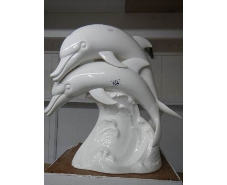 A large white ceramic dolphin group 49 cm tall a/f base has a number of hairline cracks.