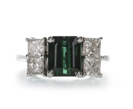 GREEN GEM SET AND DIAMOND RING, the step cut green gem flanked by four princess cut diamonds totalling approximately 1.00 car