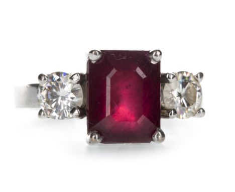 RED GEM SET AND MOISSANITE THREE STONE RING, set with a step cut red gem 9mm long, flanked by two round moissanites, marked 1