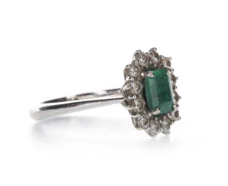 EMERALD AND DIAMOND CLUSTER RING BY MIRCO VISCONTI, the step cut emerald of approximately 1.11 carats surrounded by round bri