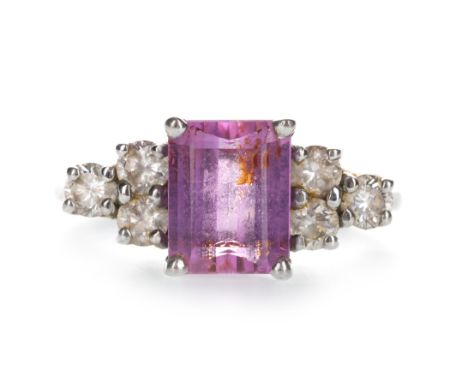 PINK GEM SET AND DIAMOND RING, the step cut pink gem 9.2mm long, flanked by three round brilliant cut diamonds on either shou