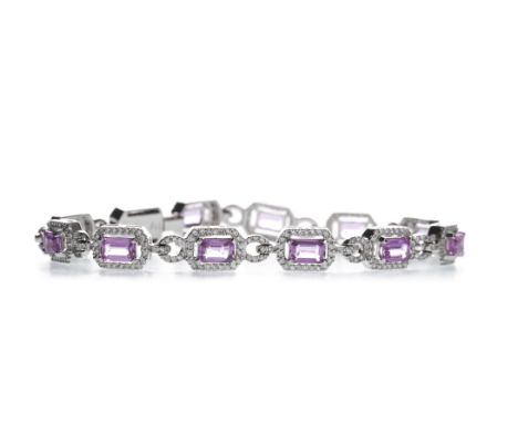 PINK SAPPHIRE AND DIAMOND BRACELET, set with step cut pink sapphires totalling approximately 10.96 carats, each within a halo