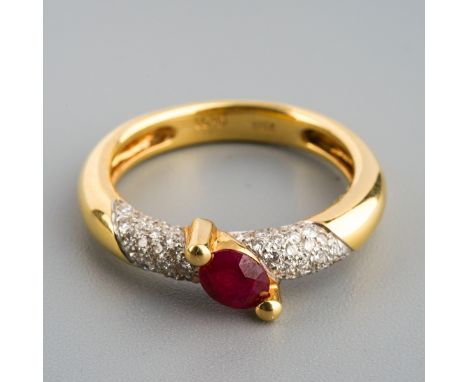 A ruby and diamond dress ring. Set with an oval ruby, claw set, to the pave set diamond sides and plain polished band, stampe