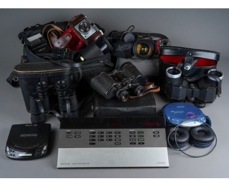 A Canon T70 camera, together with a Canon Zoom lens FD 28-85mm 1:4, a Canon Crystal Quartz Super Wide AF Macro 0.42X lens, a 