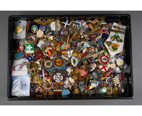 A tray of 20th century enamel badges, pin badges, tie pins, etc, including Robertsons, military, sports, clubs, newspapers, e