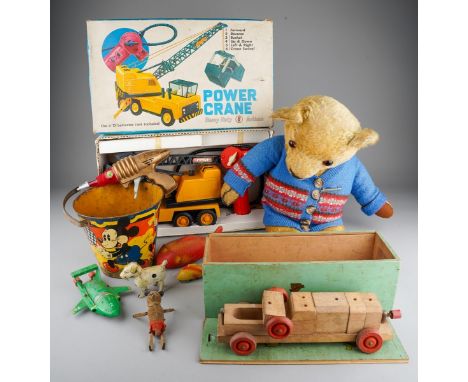 A boxed Hercules battery powered remote control power crane, used condition, together with a box of assorted vintage toys inc