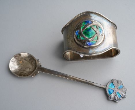 An Archibald Knox for Liberty &amp; Co: an Arts &amp; Crafts silver and enamel napkin ring with central Celtic motif, hallmar
