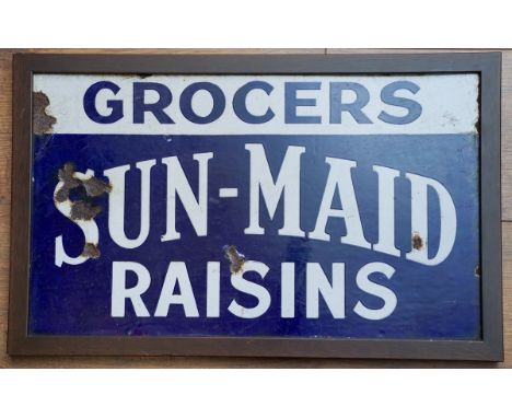 An enamel advertising sign for GROCERSS SUN-MAID RAISINS., the sign 29.5 x 50cm, framed and backed