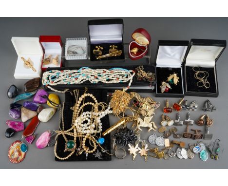 A quantity of costume jewellery, silver jewellery, cufflinks, tie clips, etc to include brooches in the form of insects, anim