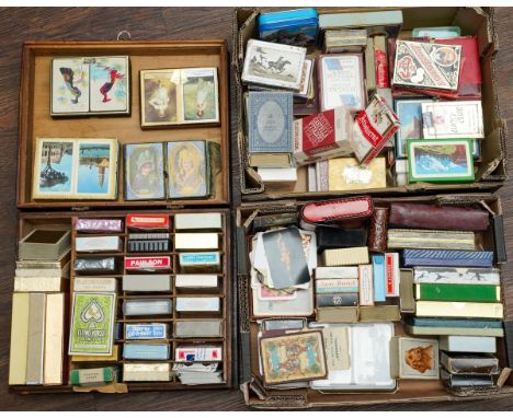 A wooden box and two other boxes containing a collection of playing cards and card games, from circa 1920s onwards, some in d