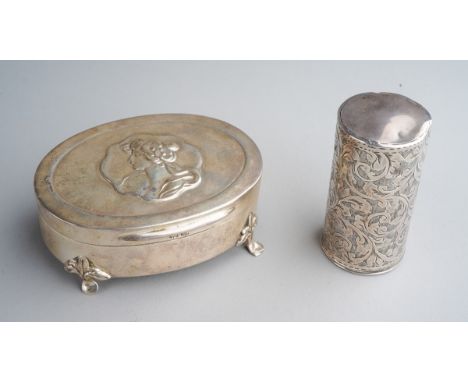 An Edwardian oval ring box, the cover embossed with profile portrait of a woman, on four scroll supports, hallmarked H Matthe