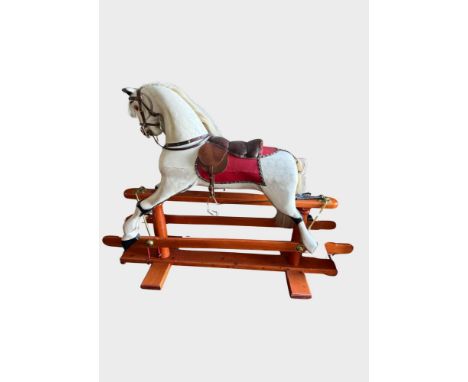 Large Rocking Horse, with leather saddle and hand-painted body complete with real horse hair mane.  Approx. 160cm long, 126cm