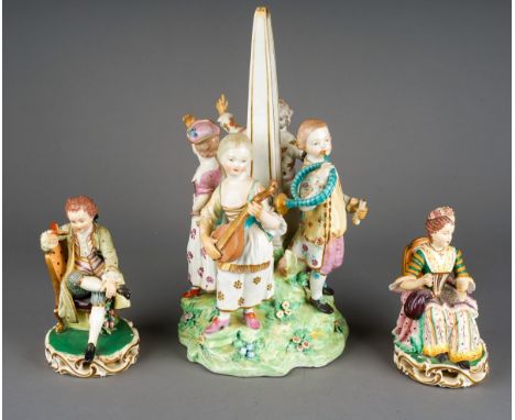 A pair of early 19th century Derby figures of seated boy and girl in 18th century style dress, on open scrolling gilt base,  