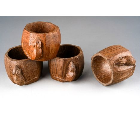 Robert Mouseman Thompson of Kilburn: a set of four carved oak octagonal napkin rings with mouse signatures, approx 4cm high [