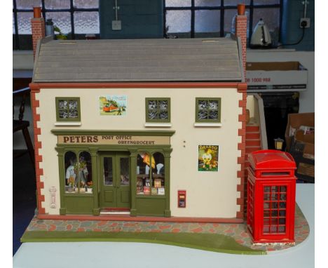 Dolls House Interest: a model of a post office and greengrocery shop, with telephone box to the exterior, hinged front and ro