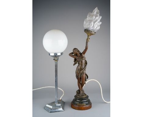 An Art Deco chrome based table lamp, the white opaque globe shade on a square column with a kite shaped loaded base, height 4