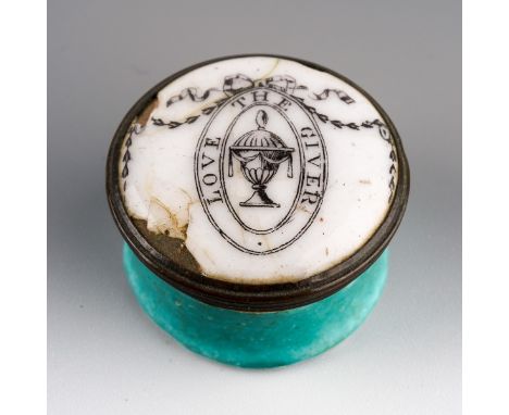 A late 18th Century Staffordshire enamel circular patch box and cover, the body with green ground, the cover with ribbon tied
