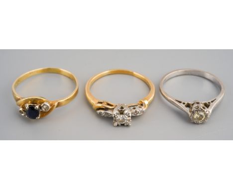 A collection of three diamond and sapphire ring. To include an 18ct gold diamond single stone ring, an 18ct gold diamond dres