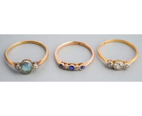 A collection of three early 20th century gem-set and diamond rings. To include a diamond three stone ring (estimated total di