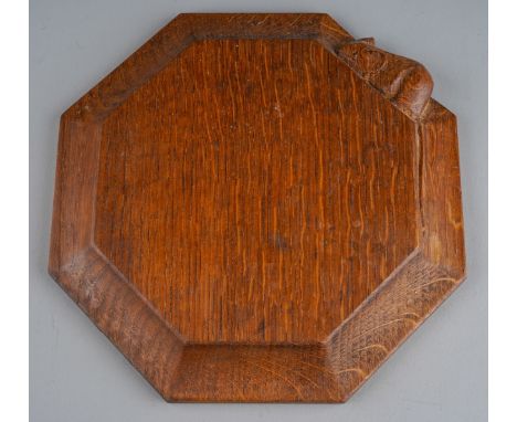 Workship of Robert Mouseman Thompson of Kilburn oak octagonal chopping board with signature mouse detail., 19cm wide