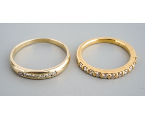 Two 18ct gold diamond eternity rings. Each set with round brilliant cut diamonds. Both hallamrked 18ct gold, one stamped 750 