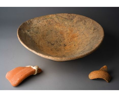 An ancient Egyptian pottery shallow sided bowl, diameter 34cm, together with two other pieces of ceramic (3)Provenance: the v