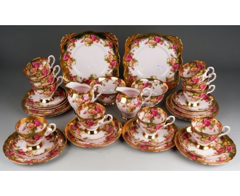 A Royal Tuscan pale pink ground tea set printed with Old Country Roses style decoration with gilt finish, pattern no 3239H, c