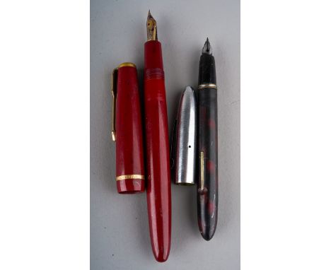 A vintage Parker Duofold 585 fountain pen, with 14K stamped nib, maroon body and cover with gilt band and small Platignum and