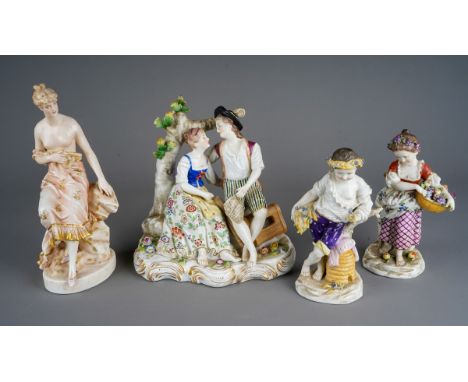 A pair of early 20th century German porcelain figures of a boy and a girl holding fruits and corn, marked M Saxc to bases, s.