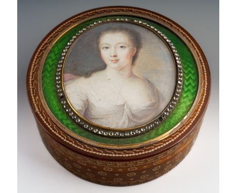 A 19th century pique tortoiseshell miniature portrait enamel trinket box. Of circular shape outline, the pique tortoiseshell 