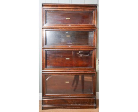 An early 20th century mahogany stained four section Globe Wernicke bookcase, name plaques to all shelves, height 166cm x widt