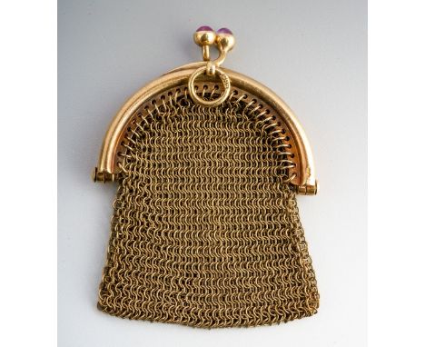 An early 20th century purse. Designed as a chainmail purse, with plain polished clasp set with two synthetic ruby cabochons, 
