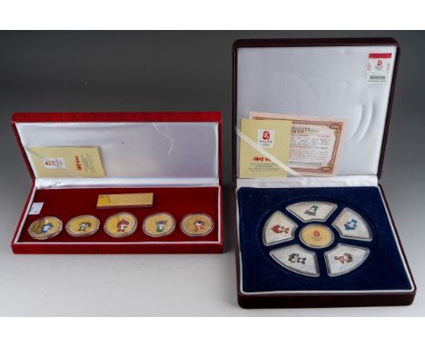 A Beijing 2008 Olympic Games FUWAS Mascots Coin Set comprising five gold plated coins, in fitted case and a 2008 Beijing Olym