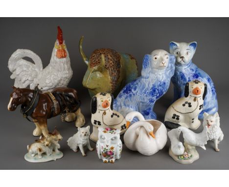 A box of 20th century ceramic animal figures, including reproduction Staffordshire pottery style items, a Studio pottery bull