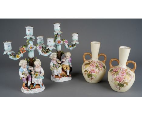 A near pair of late 19th century Plaue figural porcelain twin light candelabra, floral encrusted branches, marked to bases, s