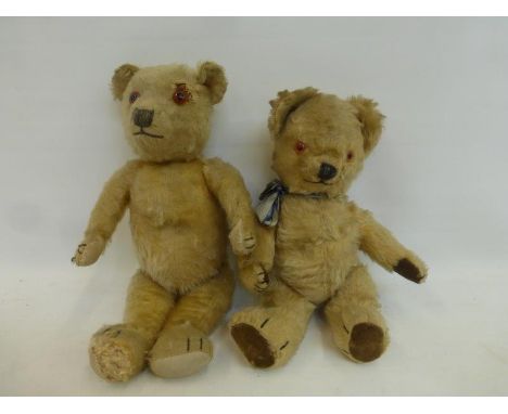 An early teddy bear, probably Chiltern, and another early teddy bear.